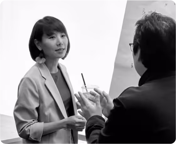 Amp discussing with a student during a class